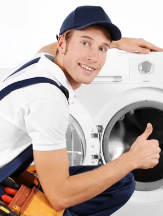 The appliance repairman guarantees the quality of his work by giving a thumbs up